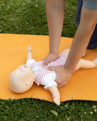 First aid training - mastering CPR techniques on a dummy