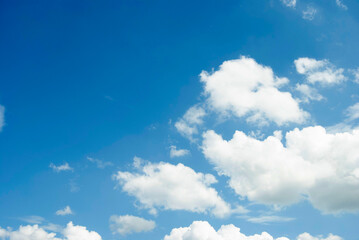 Blue sky background. Half clear half cloudy sky. Blue and white texture. sky and a cloud frame.