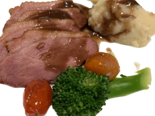 Smoked duck breast with sauce Broccoli and tomato