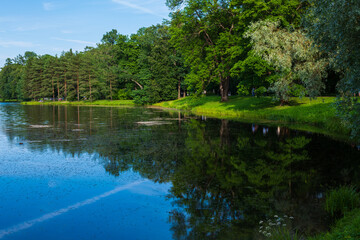 Picturesque evening landscape with reflection in the water in Catherine Park. Tsarskoe Selo, Pushkin, St. Petersburg, Russia.