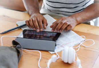 Man, hands and tablet for job search in home, newspaper and online for communication on app. Male person, information and unemployed guy for browsing career website, chatting and internet for media