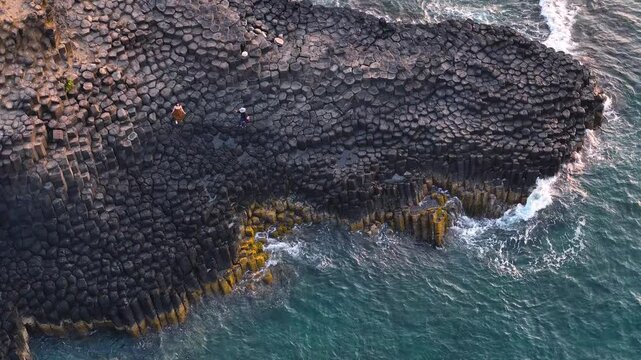 View of Ganh Da Dia or Da Dia Reef is a seashore area of uniformly interlocking basalt rock columns located along the coast in Tuy An town, Phu Yen Province, Vietnam. Travel and landscape concept