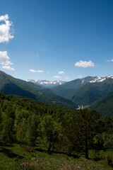 Obraz premium Mountain road winding through green hills