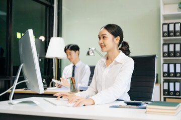Fototapeta premium Business woman using tablet and laptop for doing math finance on an office desk, tax