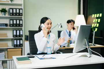 Business woman using tablet and laptop for doing math finance on an office desk, tax