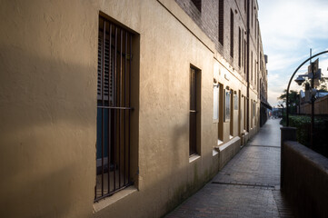 old building wall and window with metal strips