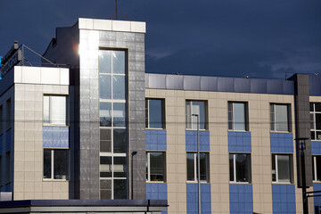 windowed corner of office building in sun day
