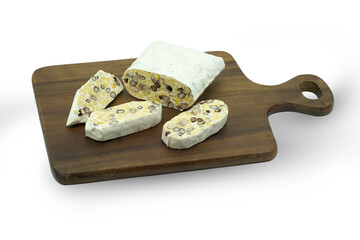 Closed up of fresh tempe or tempeh (fermented beans) on wooden cutting board with clipping path both whole from white background and each pieces of tempeh from cutting board.