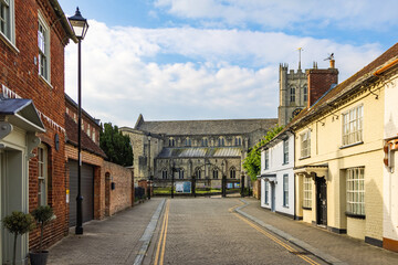 View from Church Street of the historic Christchurch Priory, built in the 11th century in Dorset , England, Uk	