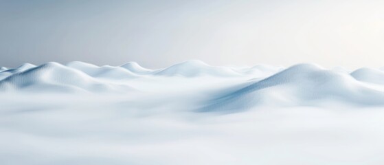 Obraz premium A serene landscape of snow-covered hills under a clear sky, creating a calm and tranquil winter scene with soft light and gentle curves.