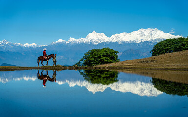 Reflection of Mountain range in Lake panchthar, Nepal.