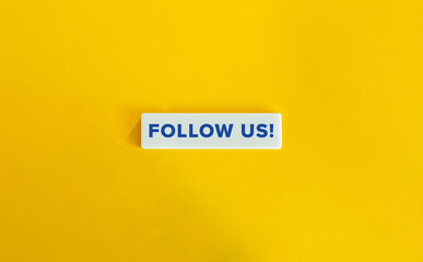 Follow Us Phrase and Engagement CTA Prompt. Blue Text on Block Letter Tile on Yellow Background. Minimal Aesthetic.