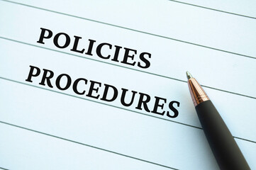 Policies and Procedures text on notepad. Company's policies and procedures concept.