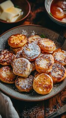 Dutch Poffertjes Mini Pancakes Dusted with Powdered Sugar on Plate