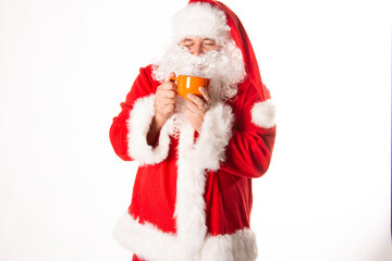 Santa Claus drinks hot coffee. White background.