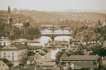 Obraz premium City summer landscape, in black-and-white color - top view of bridges over the River Vltava in the historical center of Prague, Czech Republic