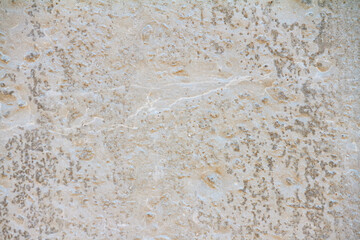 Abstract concrete background - in the form of a old rough scuffed wall, closeup