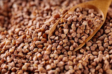 Wooden Scoop with Raw Buckwheat, Close-Up