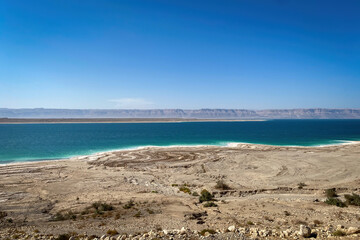 Scenic view of Dead Sea seen from Jordan looking towards Westbank against blue sky