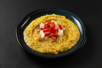 Taditional fava with olive oil and pepper. Mashed broad beans fava appetizer. Top view.