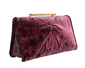 Elegant vintage purple velvet clutch with gold handle, showcasing intricate design and luxurious texture, perfect for formal events.