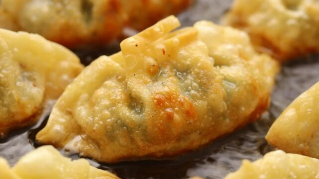 Deep fried Gyoza or Dumplings in Boiling Oil, Japanese Food 