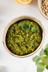 Fresh homemade pesto sauce in a bowl. Italian cuisine. Recipe.