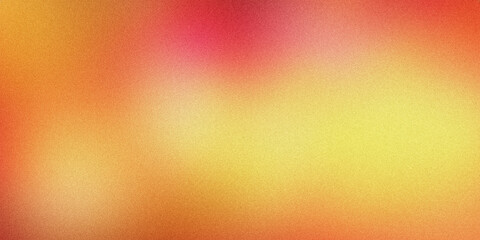 Abstract background with a grainy texture and a warm gradient of colors blending from yellow to orange and red