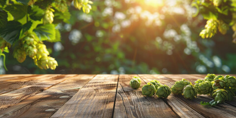 Hop fruits lie on a wooden surface close-up on a blurred background of a hop garden. Copyspace, place for text.