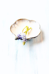 Purple flowers on bright wooden background. Close up. Copy space	