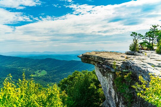 Stunning view from McAfee Knob in Virginia with a clear blue sky and lush green mountains