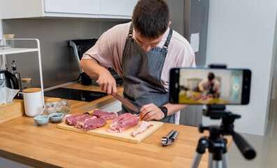 The chef is broadcasting live from workshop how to prepare a beef steaks on the electric grill