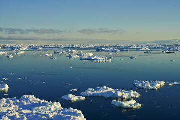 Antarctica, horizon and water with iceberg in ocean for cold ecosystem of environment in winter season. Climate change, earth and sky with frost on frozen sea for conservation of mother nature