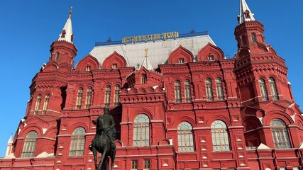 Moscow, Russia - July 12, 2024: Entrance to Red Square, building of Historical Museum on summer, 
 Iberian Gate, Moscow, Russia.