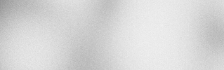 Abstract silver metallic background with light reflections creating a grainy texture