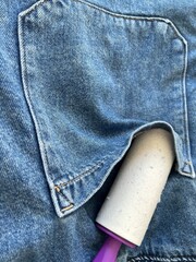 Lint roller to remove particles from clothing 