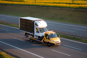 Commercial Cargo Vehicle Bus Transportation By Towing Truck Flatbed