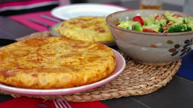 Homemade  Spanish omelette  (tortilla de patatas) take center stage at a Spanish famil