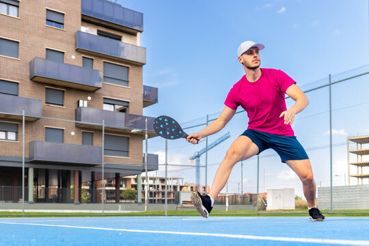 Portrait of a young pickleball player playing an outdoor game.