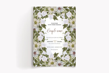 WEDDING INVITATION FRAME WITH FLOWER DECORATIONS AND FRESH LEAVES