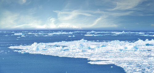Cold, beach and snow or iceberg with climate change or cloudy sky, nature and environmental. Natural, ocean and water on cold season or freezing weather with global warming and frozen in Denmark