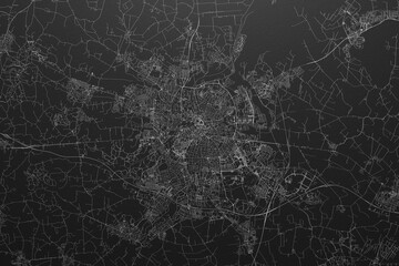 Street map of Odense (Denmark) on black paper with light coming from top