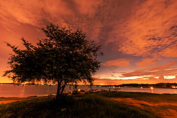 The background of the sea by the evening sea, with natural beauty (sea water, rocks, sky) and fishermen are fishing by the river bank, is a pleasure during travel.