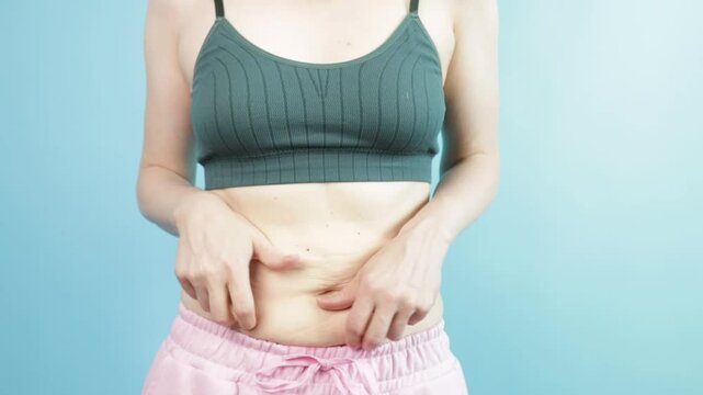Overweight, woman touching fat belly, excess size and weight loss.