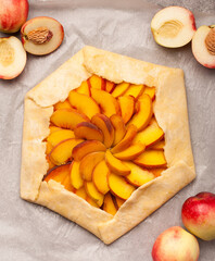 Peach galette, homemade pie. Top view. 