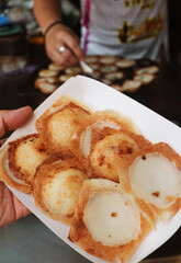 Sweet and fragrant Thai coconut milk pancakes called Kanom Krok, one of the popular street food in Thailand