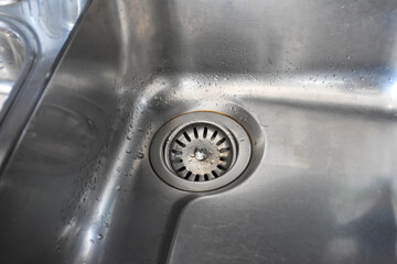 Silver sink with plug in kitchen