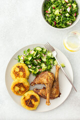 Chickpea cutlets with mixed salad with cucumbers and radishes, baked farm chicken legs, a delicious hearty lunch or dinner
