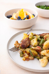 Stewed duck fillet with potatoes and asparagus and radishes, mixed salad of various greens, baked carrots in tahini sauce, orange and blueberry for dessert, healthy delicious breakfasts or lunches