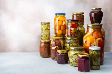 Preserving vegetables for the winter, canned vegetables and adjika, jam and vegetable salads, pickled or fermented vegetables, copy space